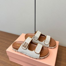 미우미우 MIUMIU 캔버스 슬라이드 뮬 MU014835